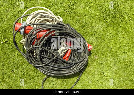 Power three phase wire extension cord for high voltage wires. Stock Photo