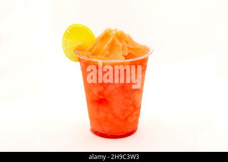 Strawberry slush with lemon slice served in a disposable cup. Stock Photo