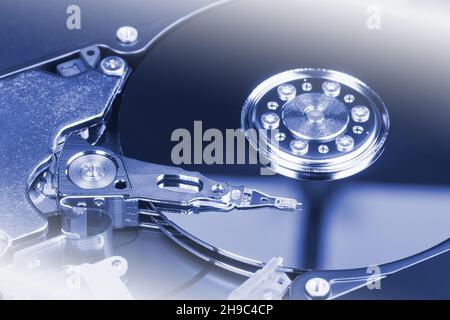 Magnetic head above the surface of the hard drive. Internal hard disk device Stock Photo