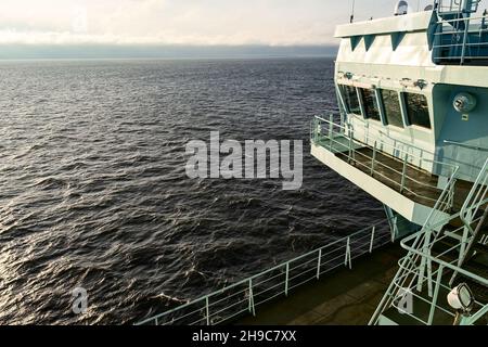 Close-up of the wheelhouse. The captain's bridge. Reflections of the sea are visible in the windows of the bridge Stock Photo