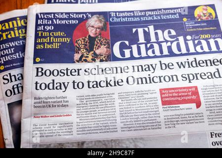 'Booster scheme may be widened today to tackle Omicron spread' Guardian newspaper headline Omicron covid on front page 29 November 2021 in London UK
