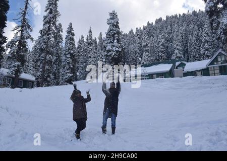 Indian tourists enjoy sledge ride at snow covered ski resort Gulmarg after the season's first heavy snowfall. Stock Photo