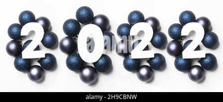 New year 2022 numbers on blue holiday balloons. White background. Copy space , new 2022 offensive concept