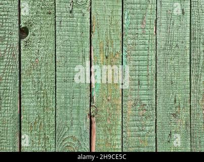 Rough old wooden planks painted in green color as texture background Stock Photo