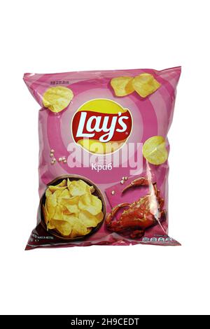 KHARKOV, UKRAINE - JANUARY 3, 2021: Various flavoured of lay's and pringles potato chips in classic packages design. Worldwide famous brands of potato Stock Photo