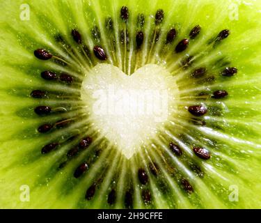 Closeup of kiwi fruit with heart shape in the middle Stock Photo