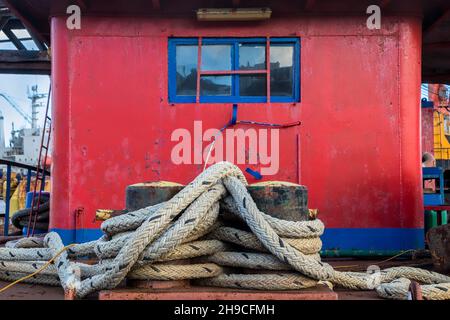 Fishing Boat tied up at wharf in shipyard. Isolated. Stock Photo