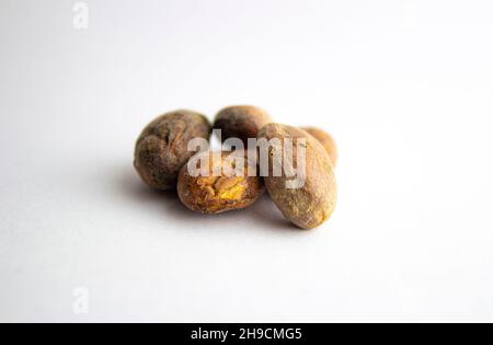 A variety of cocoa beans isolated on white backgrounds. Shallow depth of field. Stock Photo