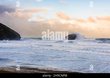 Wave from Storm Arwen crashing over Gull Rock at Portreath Beach, Cornwall, UK Stock Photo