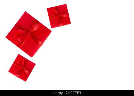 three red gift boxes on white background with copyspace Stock Photo