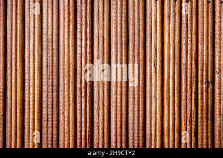 Striped wood background in brown color. Striped wood texture. Stock Photo