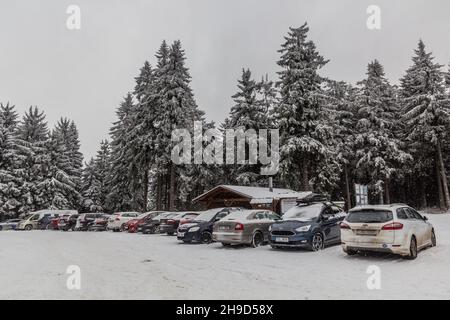 SUCHY VRCH, CZECH REPUBLIC - DECEMBER 28, 2019: Parking lot in a forest at Suchy vrch mountain, Czechia Stock Photo