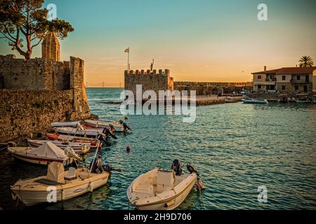 Walking at sunset in the beautiful port of Nafpaktos Stock Photo