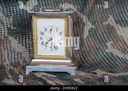 Old metal table clock with some rust and three spheres Stock Photo