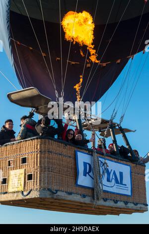 Asian tourists in the wicker basket of a hot-air ballon ready for take off near Ortahisar, Cappadocia,  Central Anatolia, Turkey Stock Photo