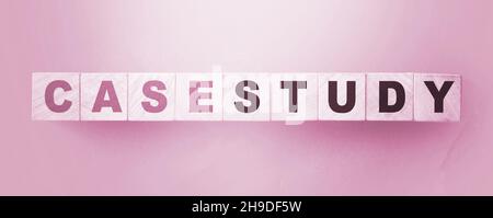 Case Study written on a wooden cubes. Examples in business and education concept Stock Photo