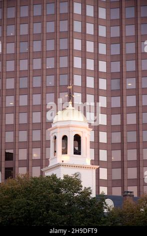 Faneuil Hall bell tower set against a modern skyscraper in Boston USA Stock Photo