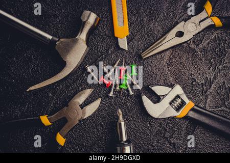 Many different tools for repair work on a black background Stock Photo