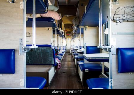 Interior of a typical russian long-distance RZD train with beds for sleeping Stock Photo