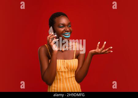 Happy african american woman having phone conversation Stock Photo