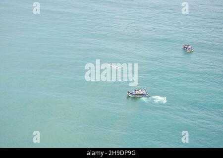 Boats taking tourists to Whale Watching Tour. Taken from a helicopter view in Kaikoura, New Zealand on Dec 9, 2010. Stock Photo