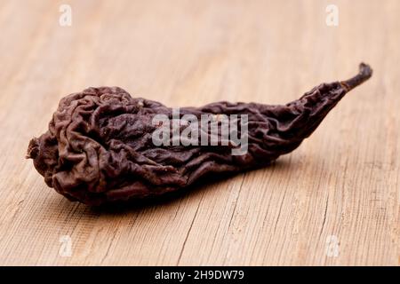 dried fruit, pear, dried pear, brown, fruit, dry, dried, one, alone, folding, background, food, typical, traditional, wood, wooden table, behind, in f Stock Photo