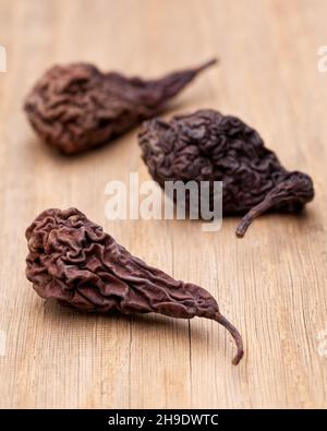 dried fruit, pear, dried pear, brown, fruit, dry, dried, one, alone, folding, background, food, typical, traditional, wood, wooden table, behind, in f Stock Photo