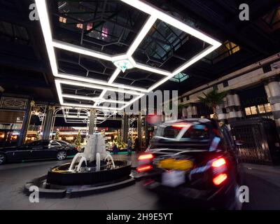 London, Greater London, England, December 04 2021: Taxi Rank and Entrance to The Savoy at Christmas time at night. A luxury hotel on The Strand. Stock Photo