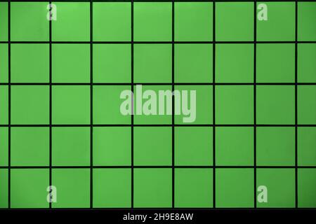 Green tile wall with geometric pattern as background material Stock Photo