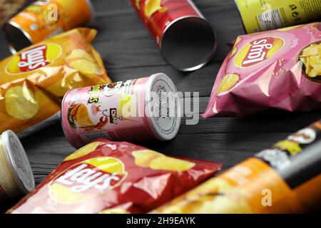 KHARKOV, UKRAINE - JANUARY 3, 2021: Various flavoured of lay's and pringles potato chips in classic packages design. Worldwide famous brands of potato Stock Photo