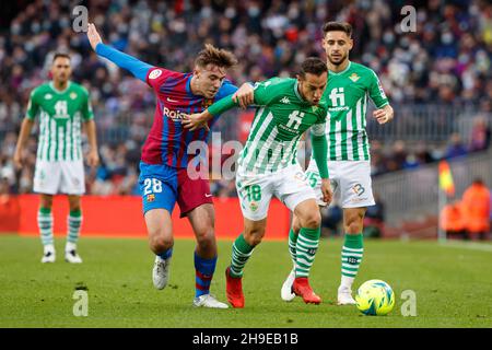 Andres Guardado of Real Betis in action with Nico of FC Barcelona during the Liga match between FC Barcelona and Real Betis at Camp Nou in Barcelona, Spain. Stock Photo