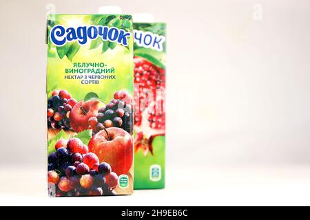 KHARKOV, UKRAINE - JULY 2, 2021: Sadochok Apple and grape nectar from red varieties and apple with pomegranate flavour juice tetra-packs Stock Photo