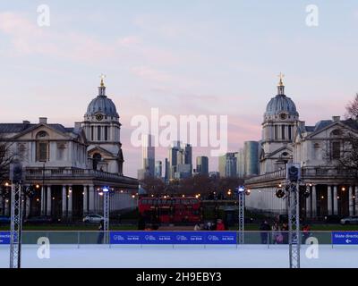 Ice Rink in Greenwich with the University Buildings behind and Sky Scrapers of Canary Wharf in the distance. Stock Photo