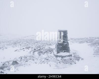Pen-Y-Ghent, Yorkshire Dales, UK. 6th December, 2021. Snow dusting and whiteout conditions leading to low visibility on the summit of Pen-Y-Ghent in the Yorkshire Dales. Credit: Ed Clews/Alamy Live News Stock Photo