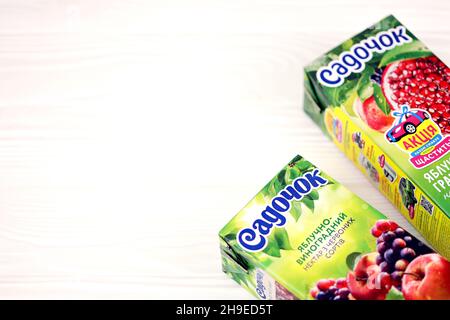 KHARKOV, UKRAINE - JULY 2, 2021: Sadochok Apple and grape nectar from red varieties and apple with pomegranate flavour juice tetra-packs Stock Photo