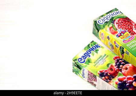 KHARKOV, UKRAINE - JULY 2, 2021: Sadochok Apple and grape nectar from red varieties and apple with pomegranate flavour juice tetra-packs Stock Photo