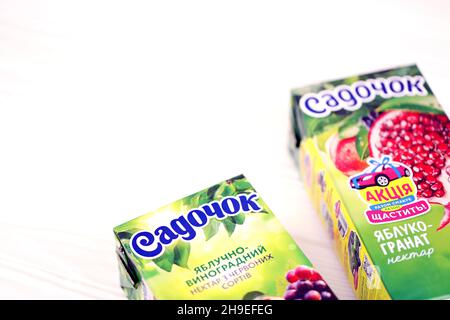 KHARKOV, UKRAINE - JULY 2, 2021: Sadochok Apple and grape nectar from red varieties and apple with pomegranate flavour juice tetra-packs Stock Photo