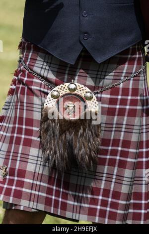 A sporran or pouch is worn as part of the Highland Scots outfit with the kilt. Stock Photo