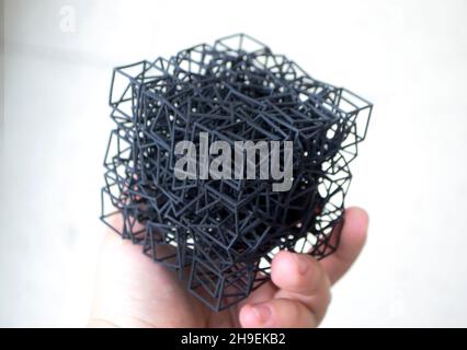 Man holding in hand model printed on 3D printer Multi Jet Fusion MJF 3D printing Stock Photo