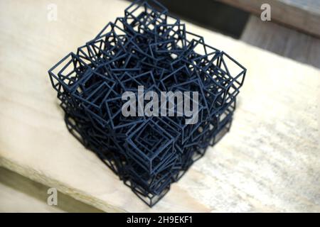 Object printed on industrial professional powder 3D printer close-up. Stock Photo