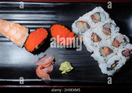 Japanese restaurant triple roll with tokiko and shrimp tail sushi Stock Photo