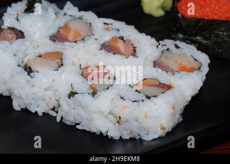 Japanese restaurant triple roll with tokiko sushi Stock Photo