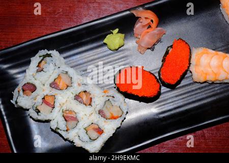 Japanese restaurant triple roll with tokiko and shrimp tail sushi Stock Photo