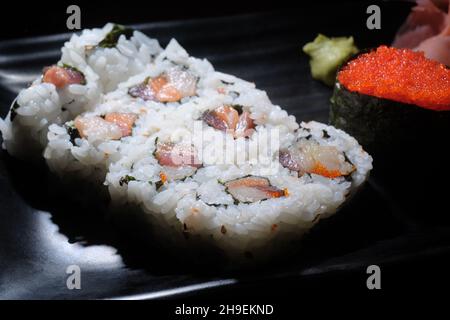 Japanese restaurant triple roll with tokiko sushi Stock Photo