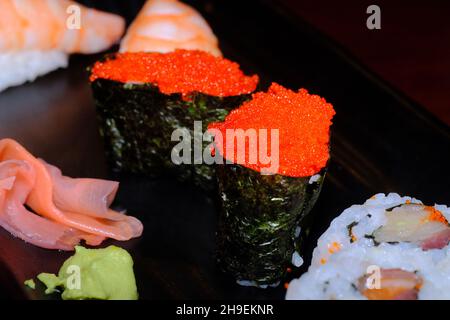 Japanese restaurant triple roll with tokiko and shrimp tail sushi Stock Photo