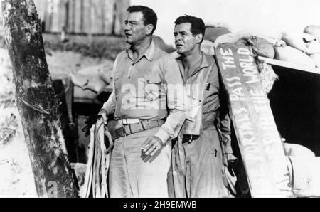 RELEASE DATE: 28 August 1951 TITLE: Flying Leathernecks STUDIO: RKO Radio Pictures DIRECTOR: Nicholas Ray PLOT: Major Kirby leads The Wildcats squadron into the historic WWII battle of Guadalcanal. STARRING: JOHN WAYNE as Major Kirby and ROBERT RYAN as Capt. Griffin. (Credit Image: ©RKO Radio Pictures/Entertainment Pictures) Stock Photo