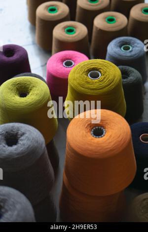 Many multi-colored bobbins of yarn. Knitting. Stock Photo