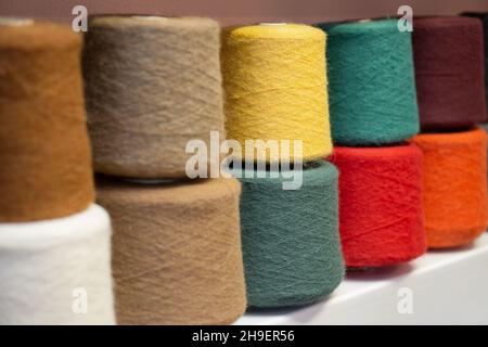 Many multi-colored bobbins of yarn. Knitting. Stock Photo