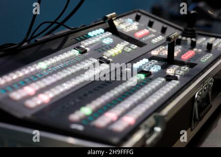 Portable video switcher in protective hard case during the live broadcast of the event. Selective focus. Stock Photo