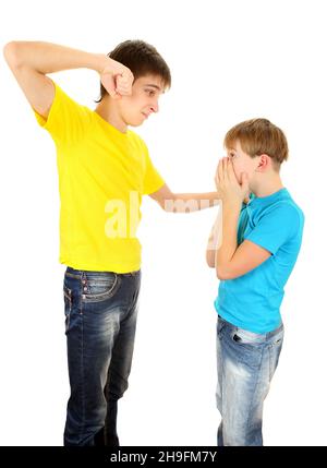 Teenager threaten a Kid on the White Background Stock Photo